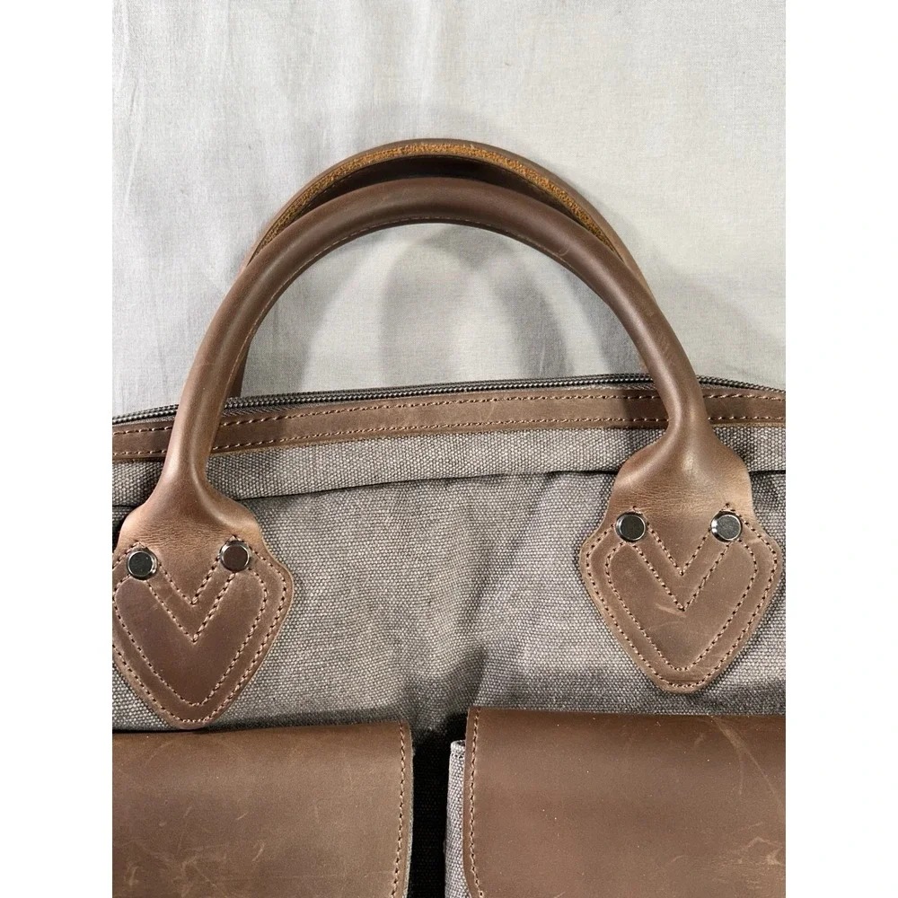 Renwick canvas briefcase featuring genuine leather trim missing shoulder strap